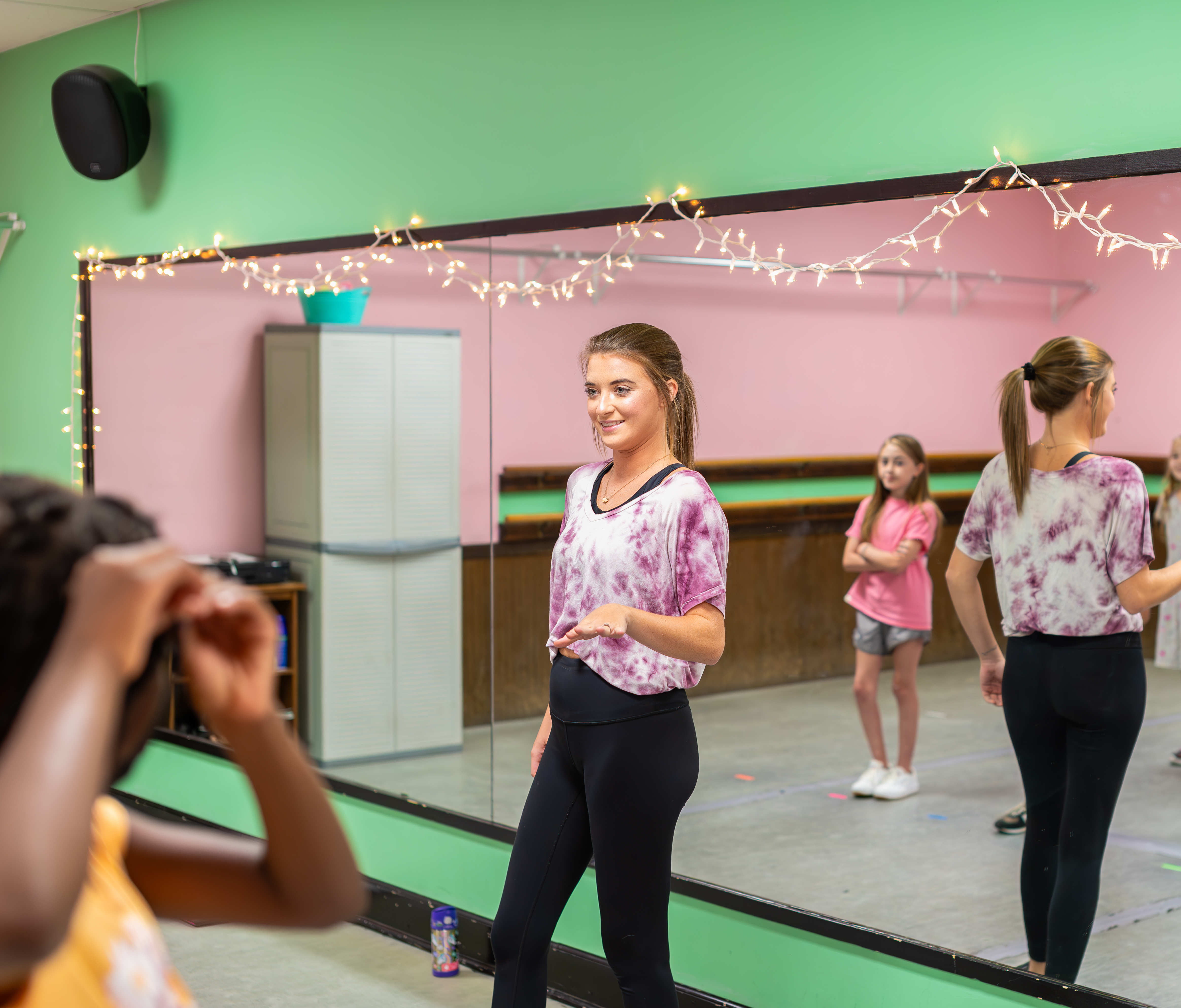 Dance class rehearsing in a mirrored Miss Libby's studio