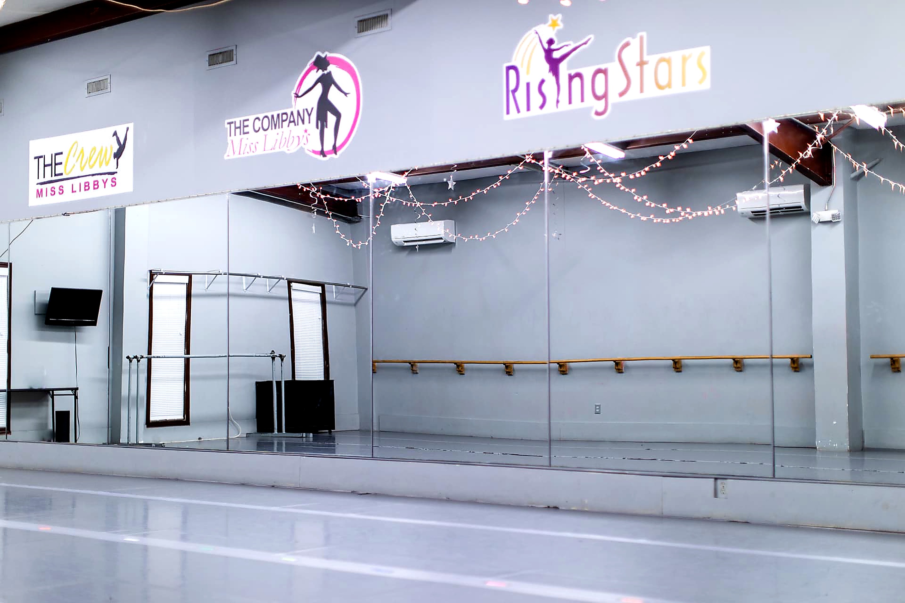 Miss Libby's dance studio with mirrored wall and marley floor