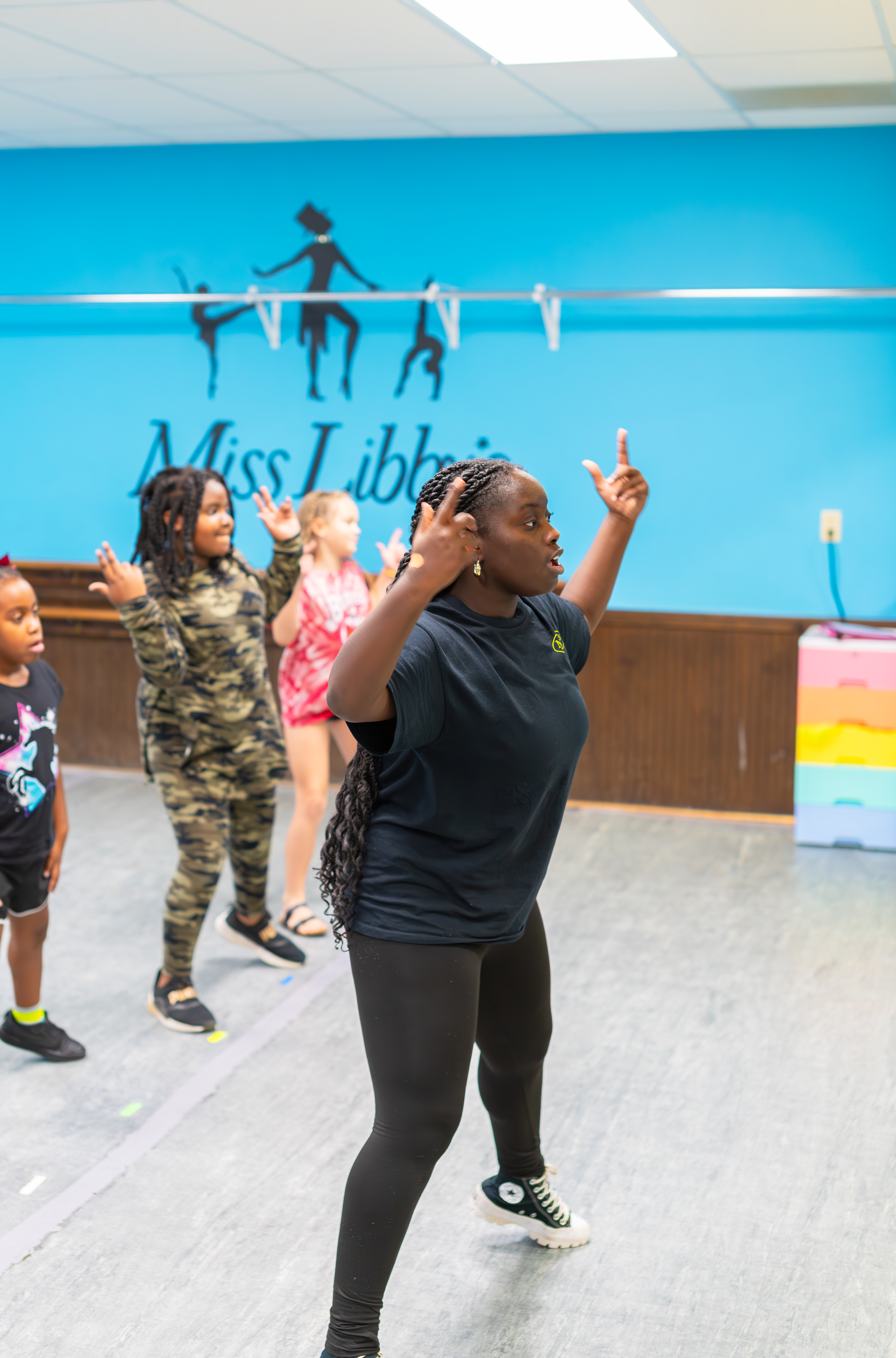 Dance instructor leading a class at Miss Libby's studio