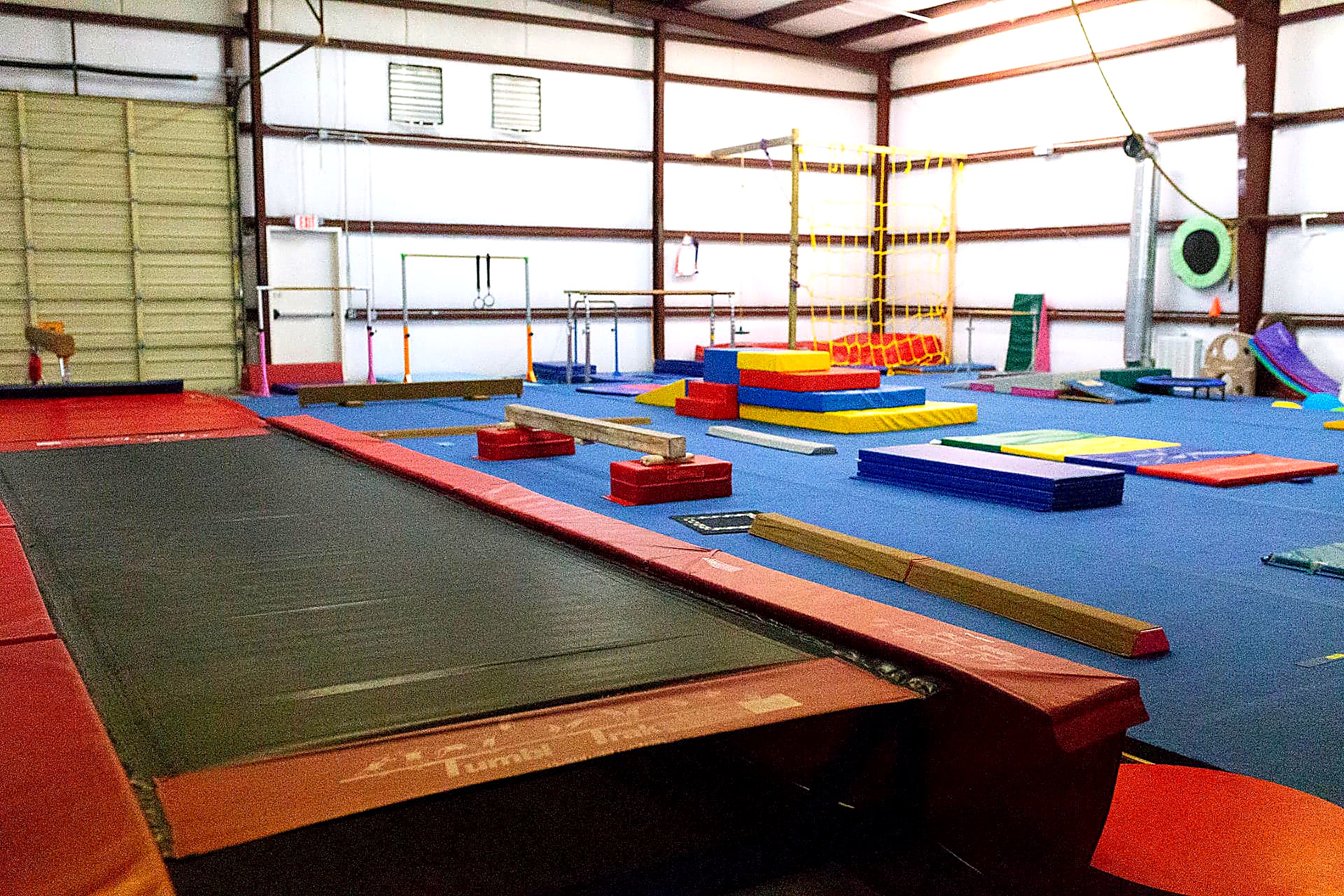 Tumble trak, low beams and folding mats on the Annex floor