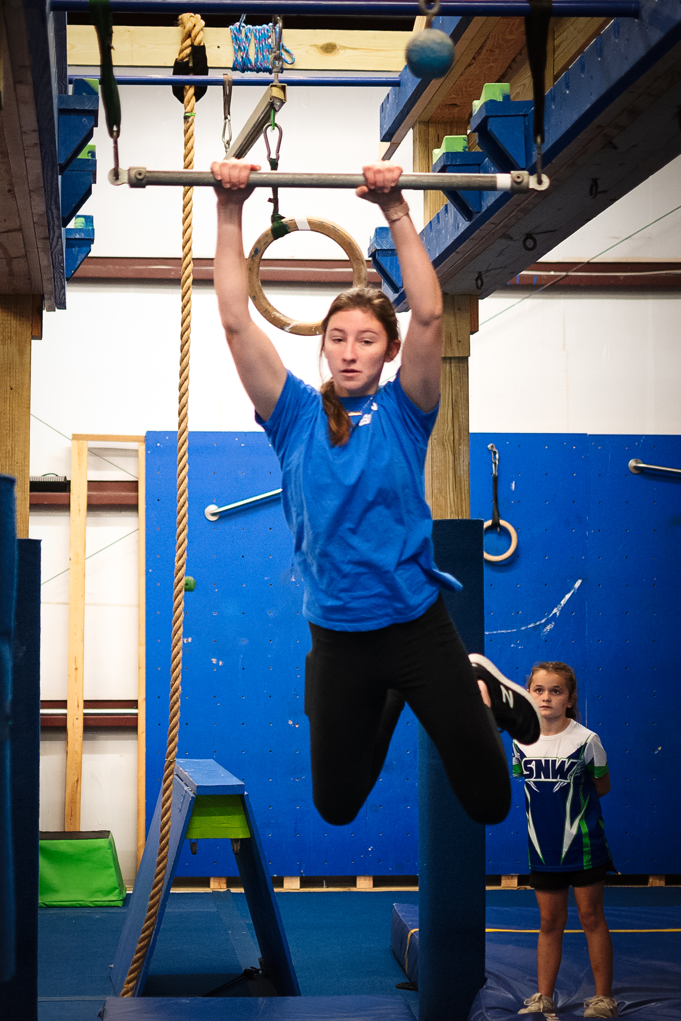 Miss Libby's ninja team athlete on the obstacle course