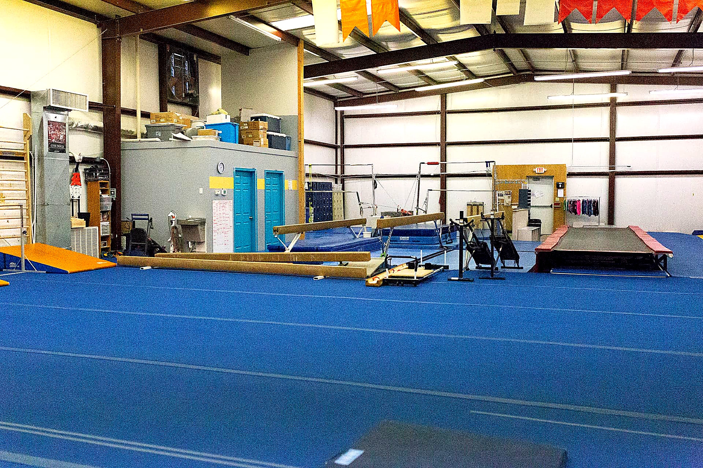 Main gymnastics floor with beams, bars and tumbling trampoline