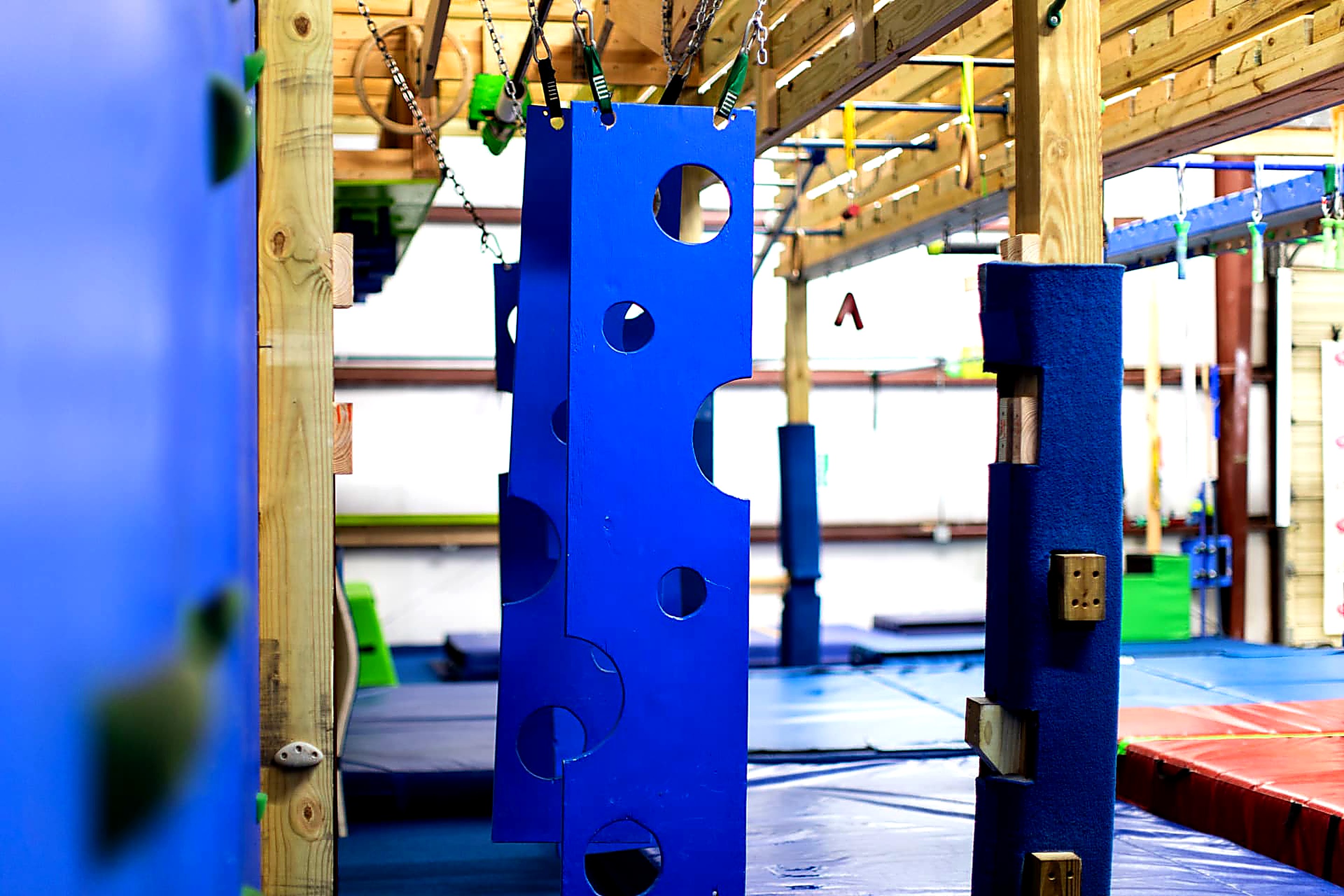 Blue hanging cheese-hole obstacles on the ninja rig