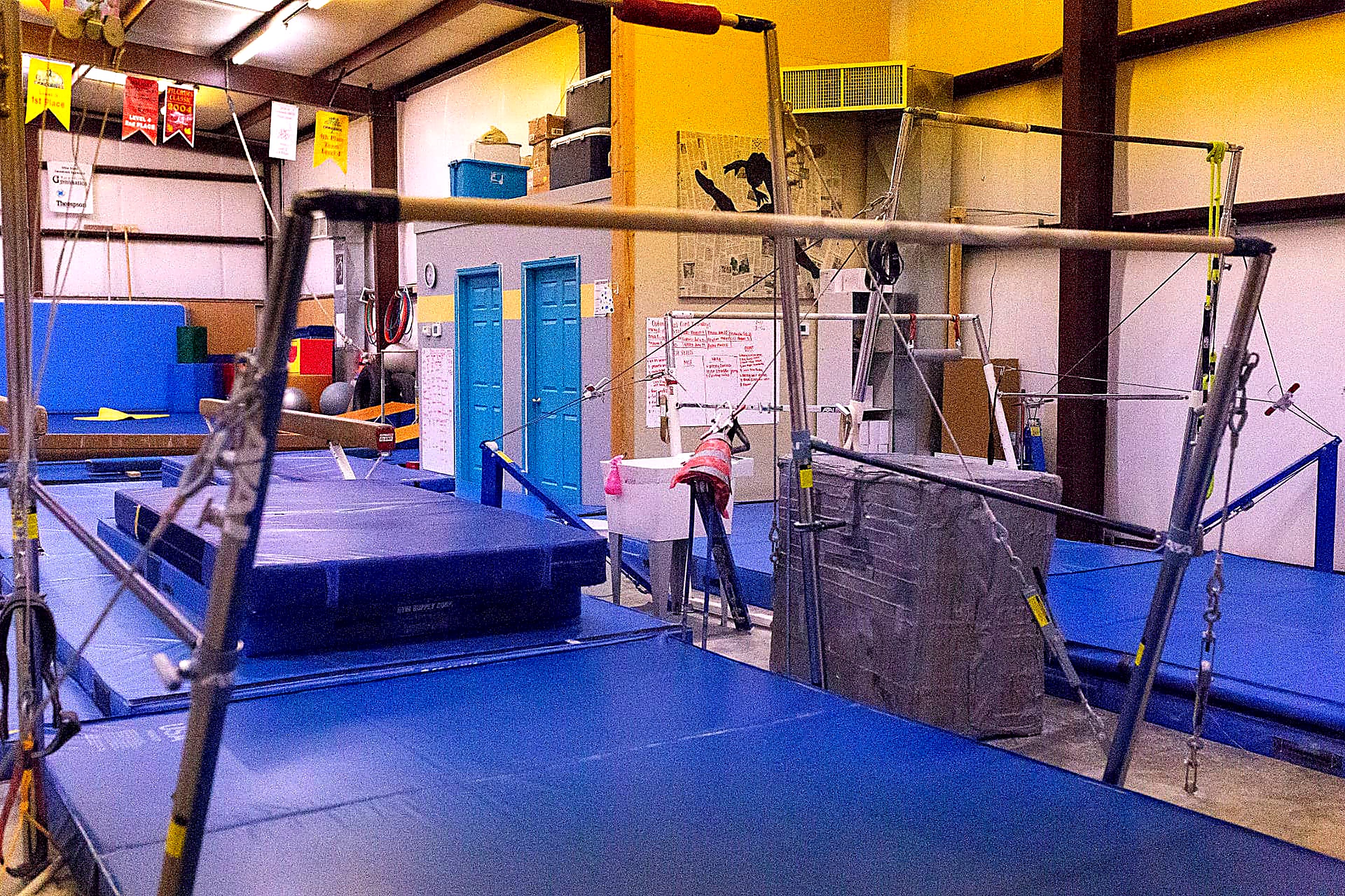 Uneven bars and landing mats in the Gymnastics Center