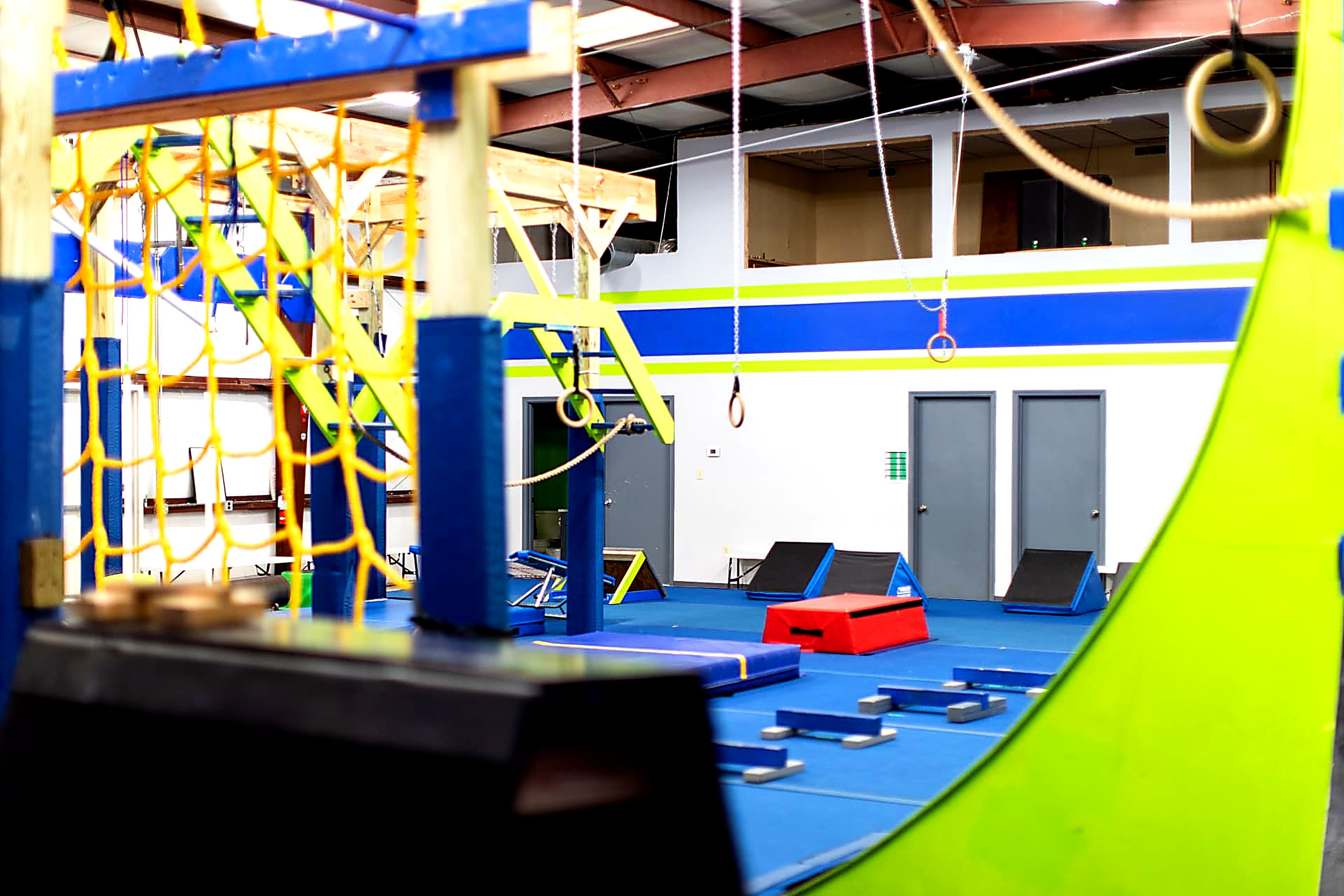 Wide view of the Sumter Ninja Warrior gym floor and rig